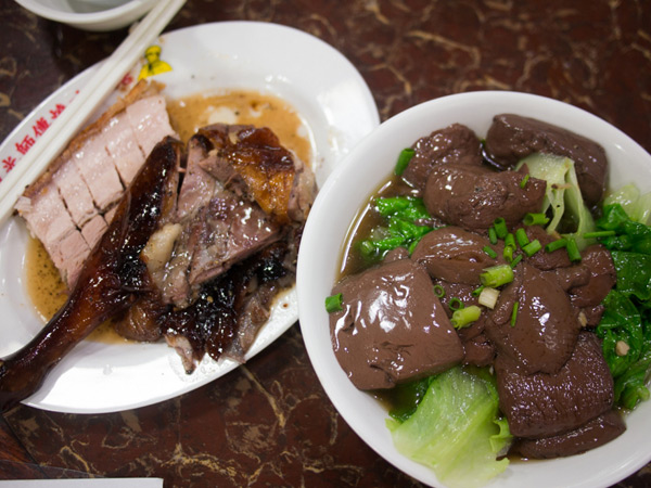roast goose with roast pork, and a side of duck blood with vegetable