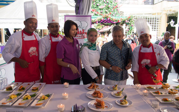 a photo with the contestants and judges, before tasting begins